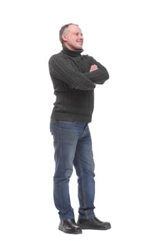 Full length of handsome young man in casual wear keeping arms crossed and smiling while standing isolated on white background
