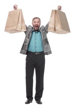 in full growth. happy man with shopping bags. isolated on a white background.