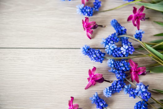 beautiful bouquet of spring flowers on a wooden table, rustic style.