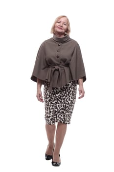 adult woman in a fashionable blouse striding forward . isolated on a white background.