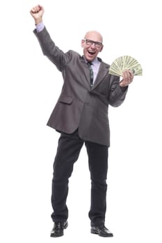 in full growth. happy business man with dollar bills. isolated on a white background.