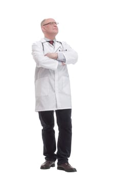 in full growth. qualified mature doctor in a white coat .isolated on a white background.