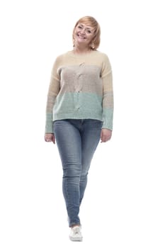 full-length. casual woman in jeans striding forward. isolated on a white background.