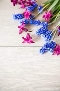 beautiful bouquet of spring flowers on a wooden table, rustic style.