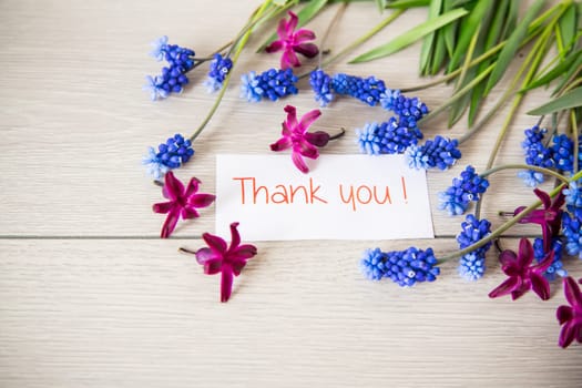 beautiful bouquet of spring flowers on a wooden table, rustic style.