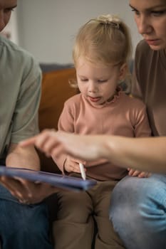 Deaf kid with hearing aid cochlear implant have fun with parents - Hear aid and medicine innovating technology and diversity