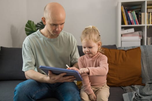 Deaf child girl with cochlear implant studying to hear sounds - recovery after cochlear Implant surgery and rehabilitation