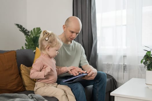 Deaf kid with hearing aid cochlear implant have fun with parents - Hear aid and medicine innovating technology and diversity