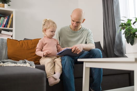 Deaf kid with hearing aid cochlear implant have fun with parents - Hear aid and medicine innovating technology and diversity