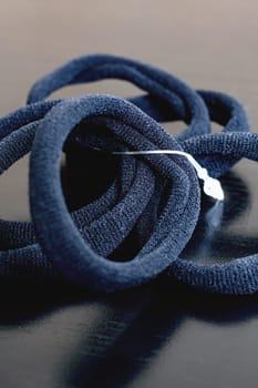 A set of rubber bands for hair on a wooden table