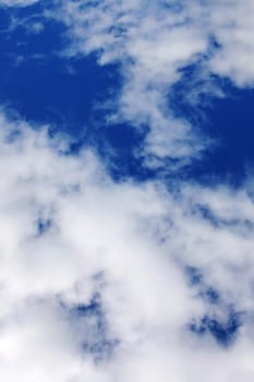 Lush white clouds in the blue sky, background