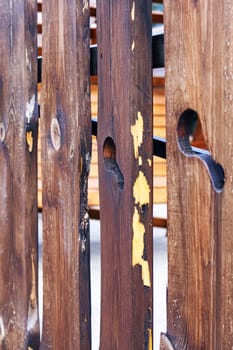 Fence from red wooden boards close up, background