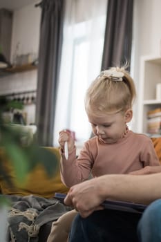 Deaf kid with hearing aid cochlear implant have fun with parents - Hear aid and medicine innovating technology and diversity