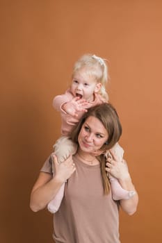 Deaf child girl with cochlear implant studying to hear sounds - recovery after cochlear Implant surgery and rehabilitation