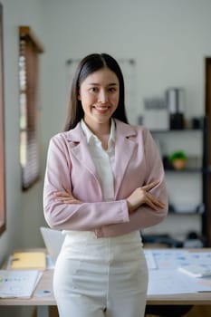 Excited businesswoman using computer laptop while in office, business concepts