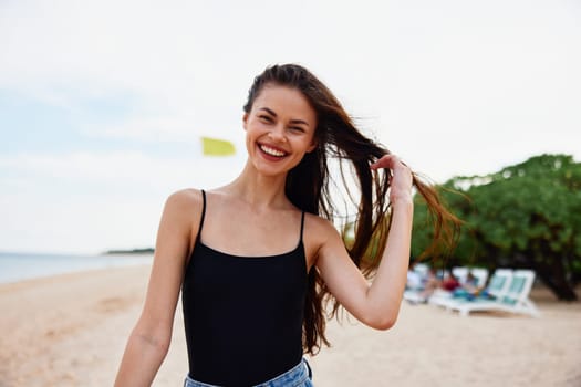 sea woman running beach nature smile water ocean relax summer sand holiday copy-space walk sunset vacation beautiful smiling carefree dress young