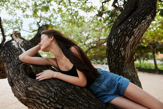 woman silhouette playing lifestyle sunny vacation model smiling nature sitting sea alone looking female horizon beauty fitness relax sky tree outdoors