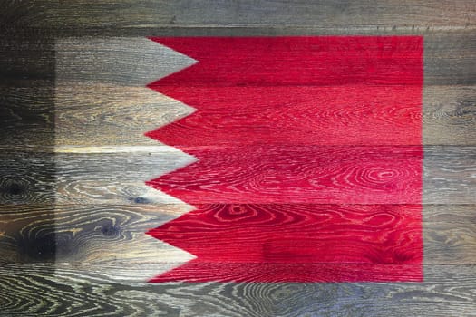 A Bahrain flag on rustic old wood surface background
