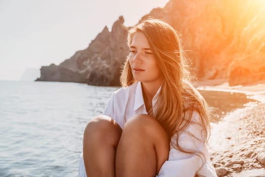 Sexy young woman in stylish bikini lying on seashore, closeup. Holiday, vacation and recreational concept.