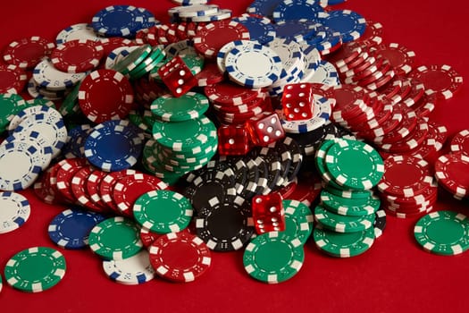 Stack of poker chips on red background at casino. Top view. Copy space. Still life. Flat lay