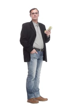 in full growth. serious business man with dollar bills. isolated on a white background.
