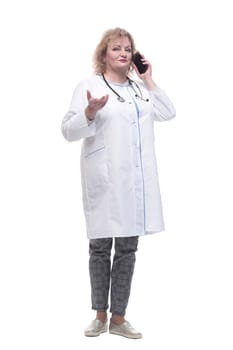 senior female doctor talking on her smartphone. isolated on a white background.