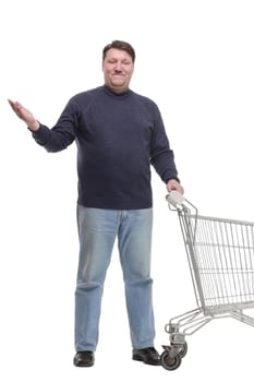 in full growth. casual mature man with shopping cart .isolated on a white background.
