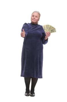 Portrait of an old woman holding money in hand and showing yes sign on white background