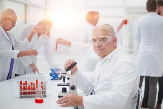 close up. smiling scientist at the workplace in the laboratory.