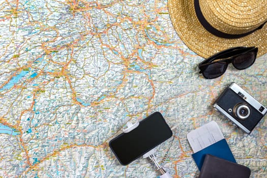 Travel plan, trip vacation accessories for trip, tourism mockup - Outfit of traveler on map background. Flat lay and copyspace. Still life