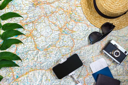 Travel plan, trip vacation accessories for trip, tourism mockup - Outfit of traveler on map background. Flat lay and copyspace. Still life