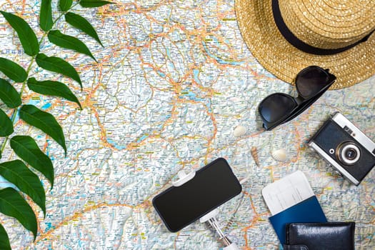 Travel plan, trip vacation accessories for trip, tourism mockup - Outfit of traveler on map background. Flat lay and copyspace. Still life