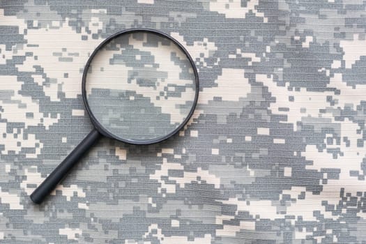 magnifier on green military uniform.