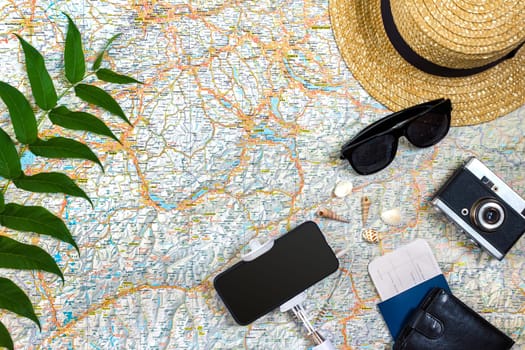 Travel plan, trip vacation accessories for trip, tourism mockup - Outfit of traveler on map background. Flat lay and copyspace. Still life