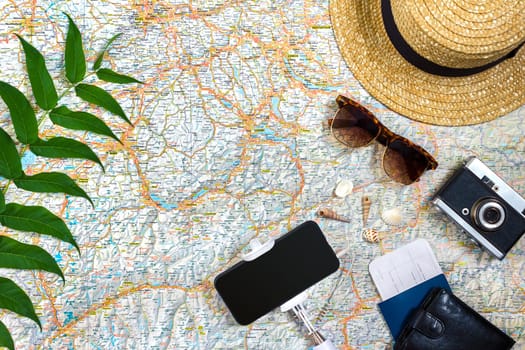 Travel plan, trip vacation accessories for trip, tourism mockup - Outfit of traveler on map background. Flat lay and copyspace. Still life