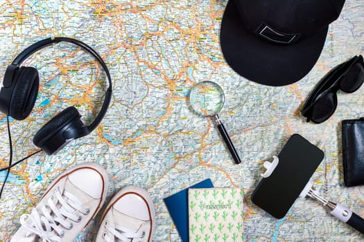 Travel plan, trip vacation accessories for trip, tourism mockup - Outfit of traveler on map background. Flat lay and copyspace. Still life