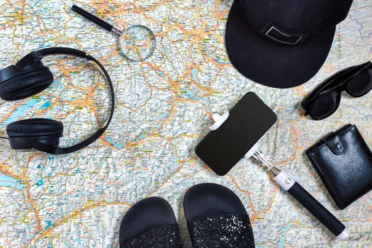 Travel plan, trip vacation accessories for trip, tourism mockup - Outfit of traveler on map background. Flat lay and copyspace. Still life