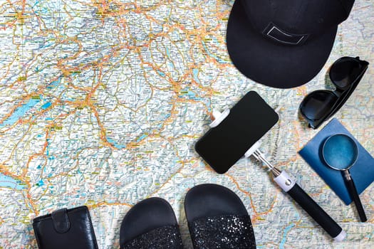 Travel plan, trip vacation accessories for trip, tourism mockup - Outfit of traveler on map background. Flat lay and copyspace. Still life