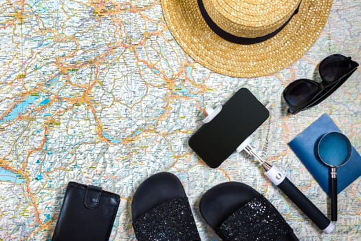 Travel plan, trip vacation accessories for trip, tourism mockup - Outfit of traveler on map background. Flat lay and copyspace. Still life
