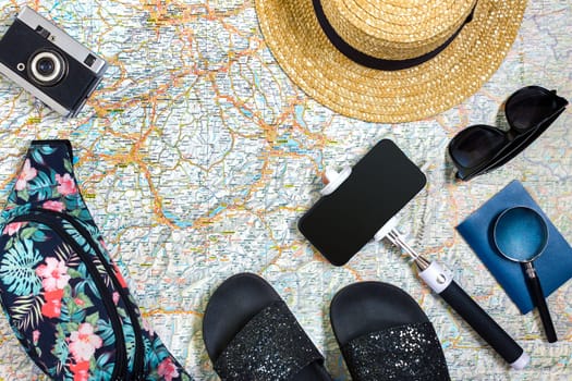 Travel plan, trip vacation accessories for trip, tourism mockup - Outfit of traveler on map background. Flat lay and copyspace. Still life
