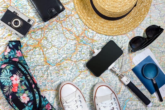 Travel plan, trip vacation accessories for trip, tourism mockup - Outfit of traveler on map background. Flat lay and copyspace. Still life
