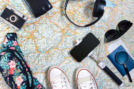 Travel plan, trip vacation accessories for trip, tourism mockup - Outfit of traveler on map background. Flat lay and copyspace. Still life