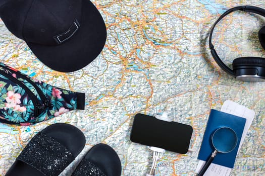 Travel plan, trip vacation accessories for trip, tourism mockup - Outfit of traveler on map background. Flat lay and copyspace. Still life