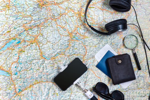 Travel plan, trip vacation accessories for trip, tourism mockup - Outfit of traveler on map background. Flat lay and copyspace. Still life