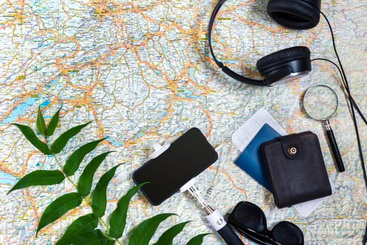 Travel plan, trip vacation accessories for trip, tourism mockup - Outfit of traveler on map background. Flat lay and copyspace. Still life