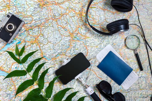 Travel plan, trip vacation accessories for trip, tourism mockup - Outfit of traveler on map background. Flat lay and copyspace. Still life