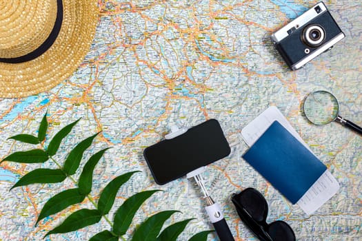 Travel plan, trip vacation accessories for trip, tourism mockup - Outfit of traveler on map background. Flat lay and copyspace. Still life