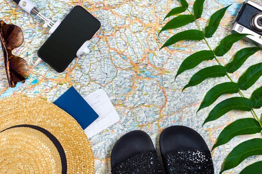 Travel plan, trip vacation accessories for trip, tourism mockup - Outfit of traveler on map background. Flat lay and copyspace. Still life