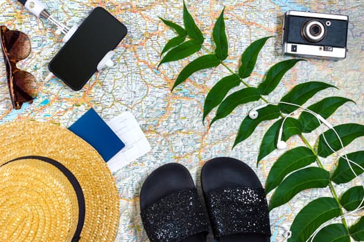 Travel plan, trip vacation accessories for trip, tourism mockup - Outfit of traveler on map background. Flat lay and copyspace. Still life