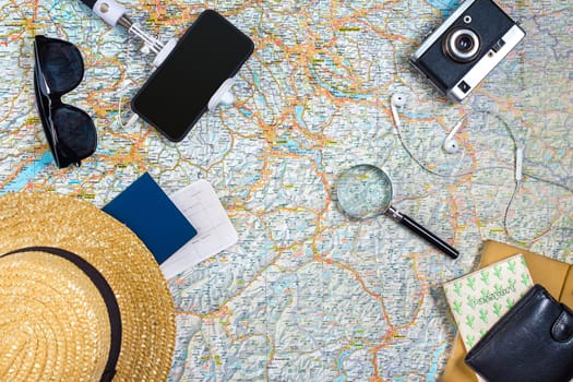 Travel plan, trip vacation accessories for trip, tourism mockup - Outfit of traveler on map background. Flat lay and copyspace. Still life